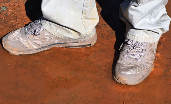Skydex Battle Trainers in red dirt/mud